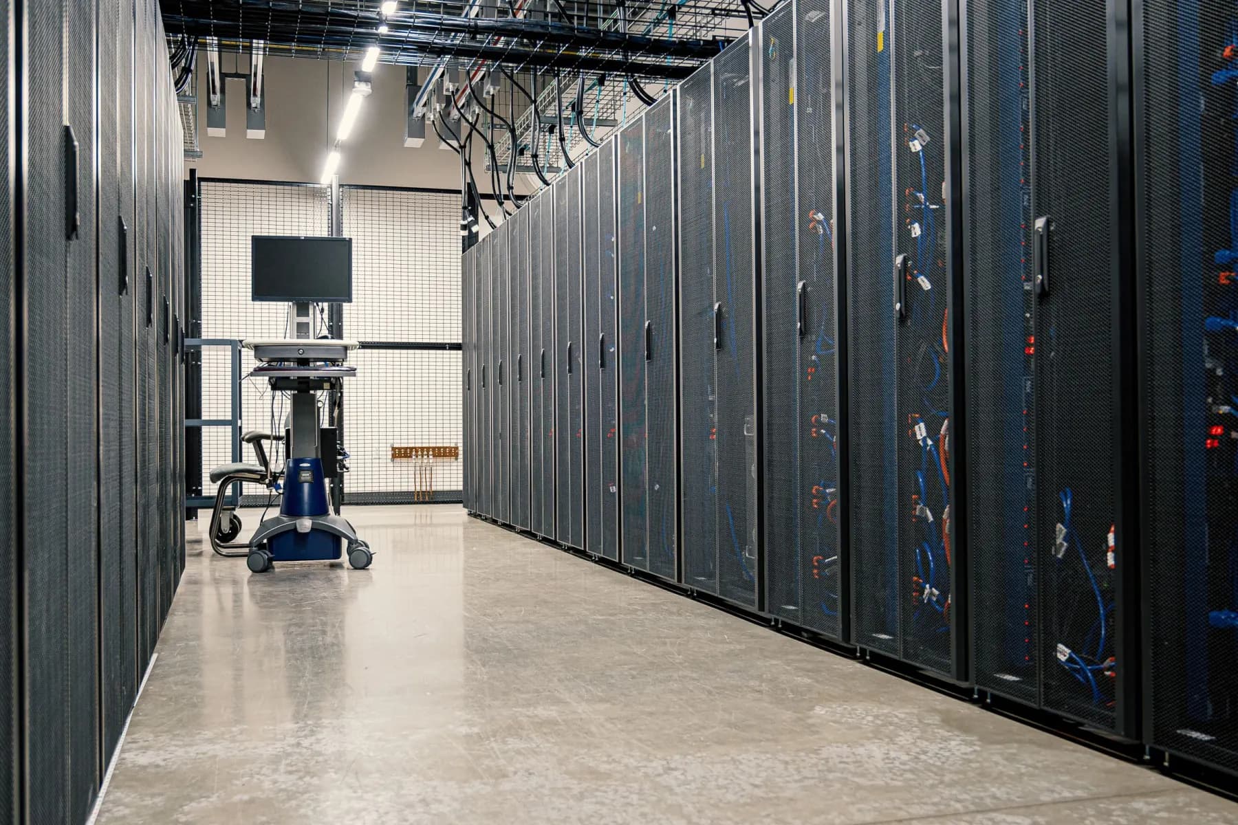 A secure data centre aisle lined with server racks