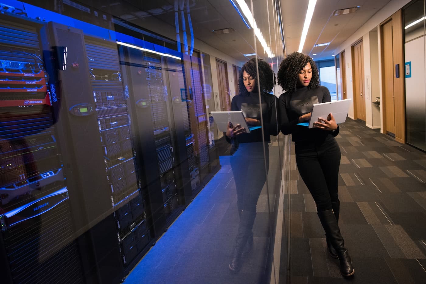 A professional reviewing data in a secure facility — the in-depth screen for senior and regulated roles