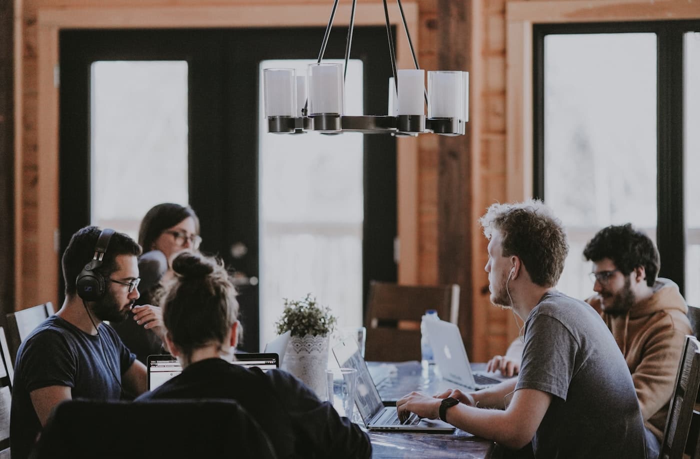 A team collaborating in an open workspace — the balanced screen for professional hires