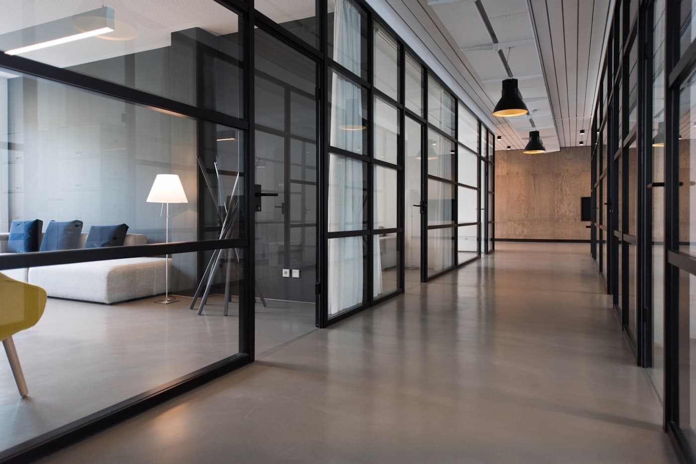 A modern glass-walled office overlooking the city